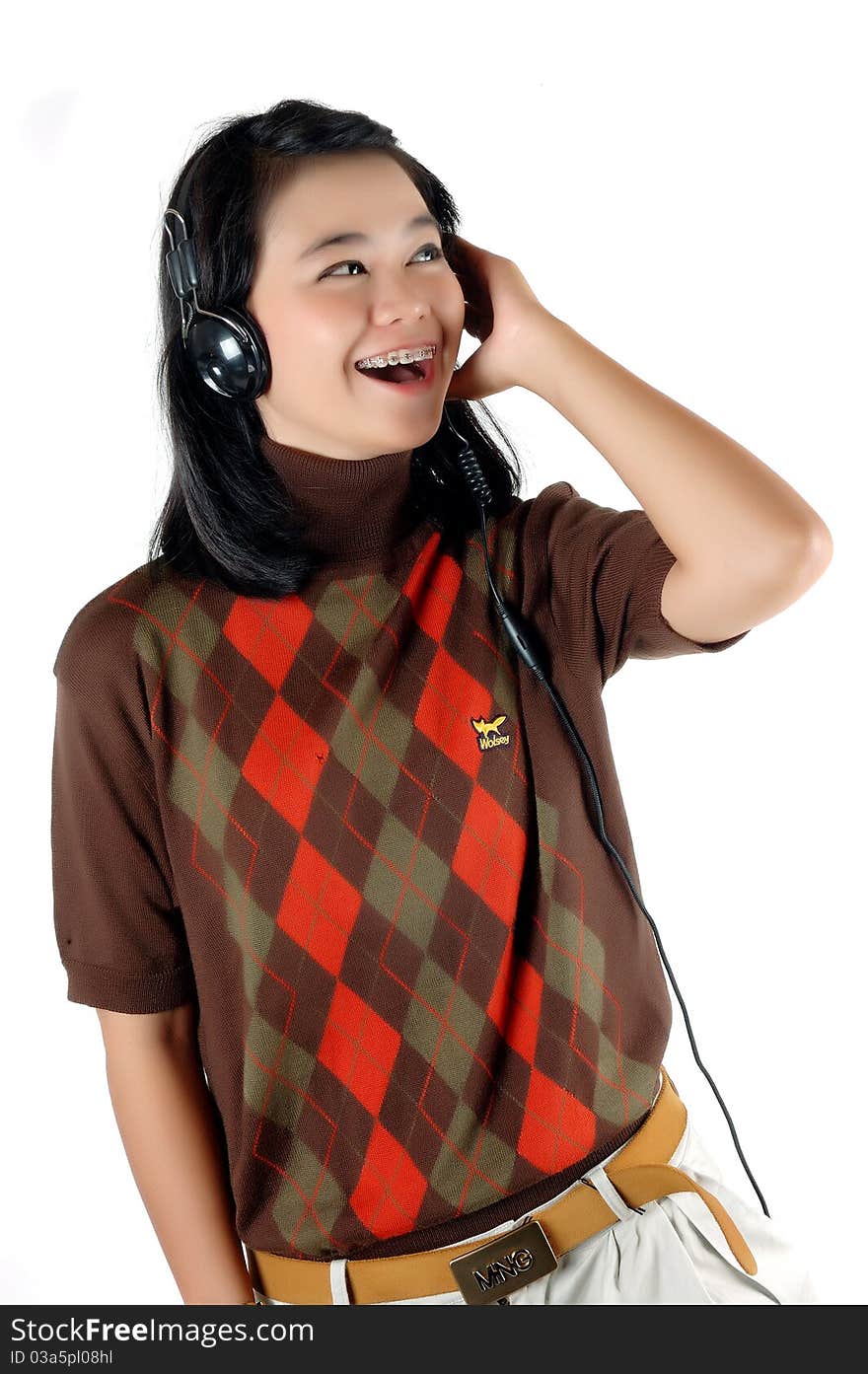 Young woman was listening music with headphone isolated on white background