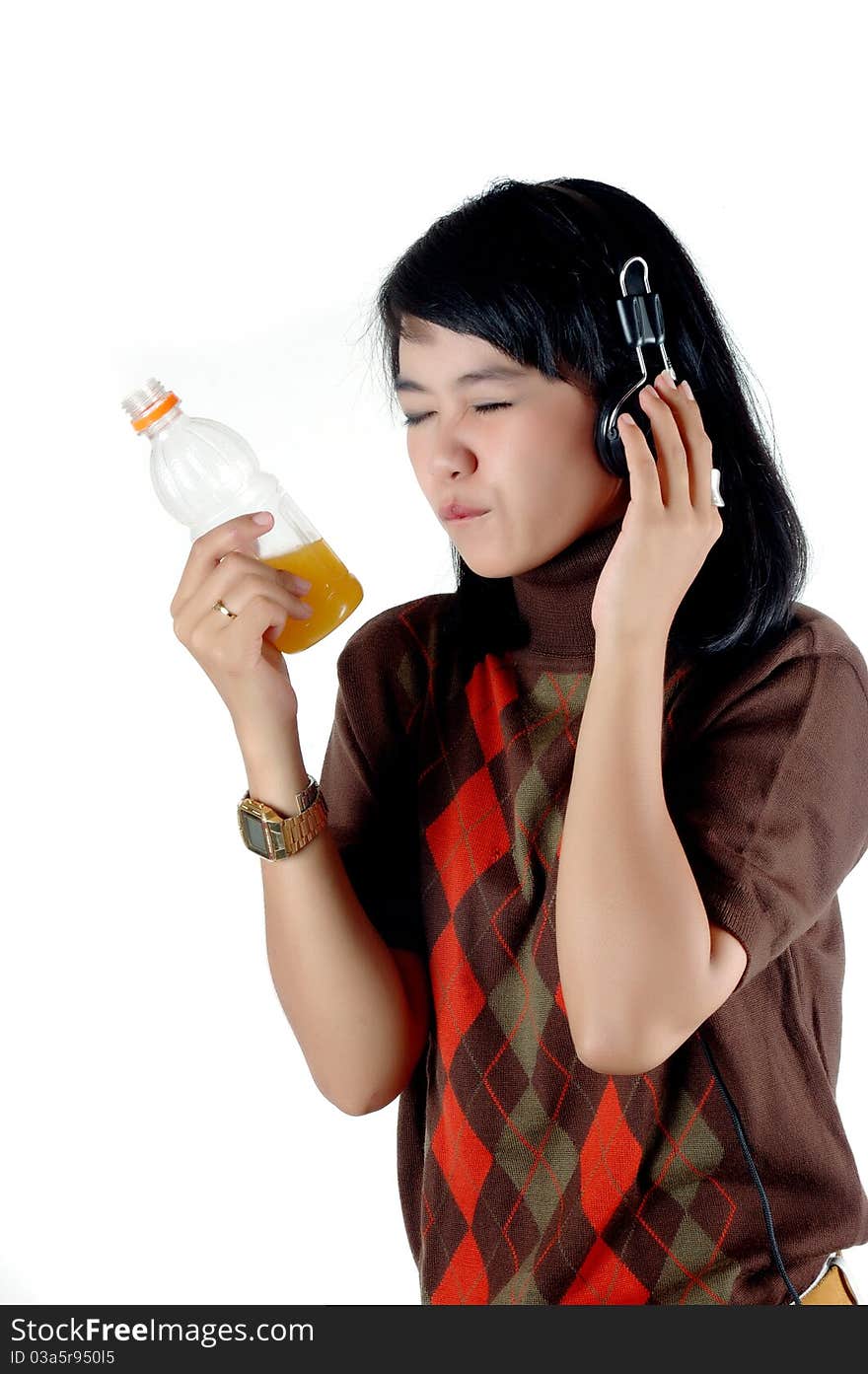 Young woman listening the music and enjoy with her soft drink isolated on white background. Young woman listening the music and enjoy with her soft drink isolated on white background