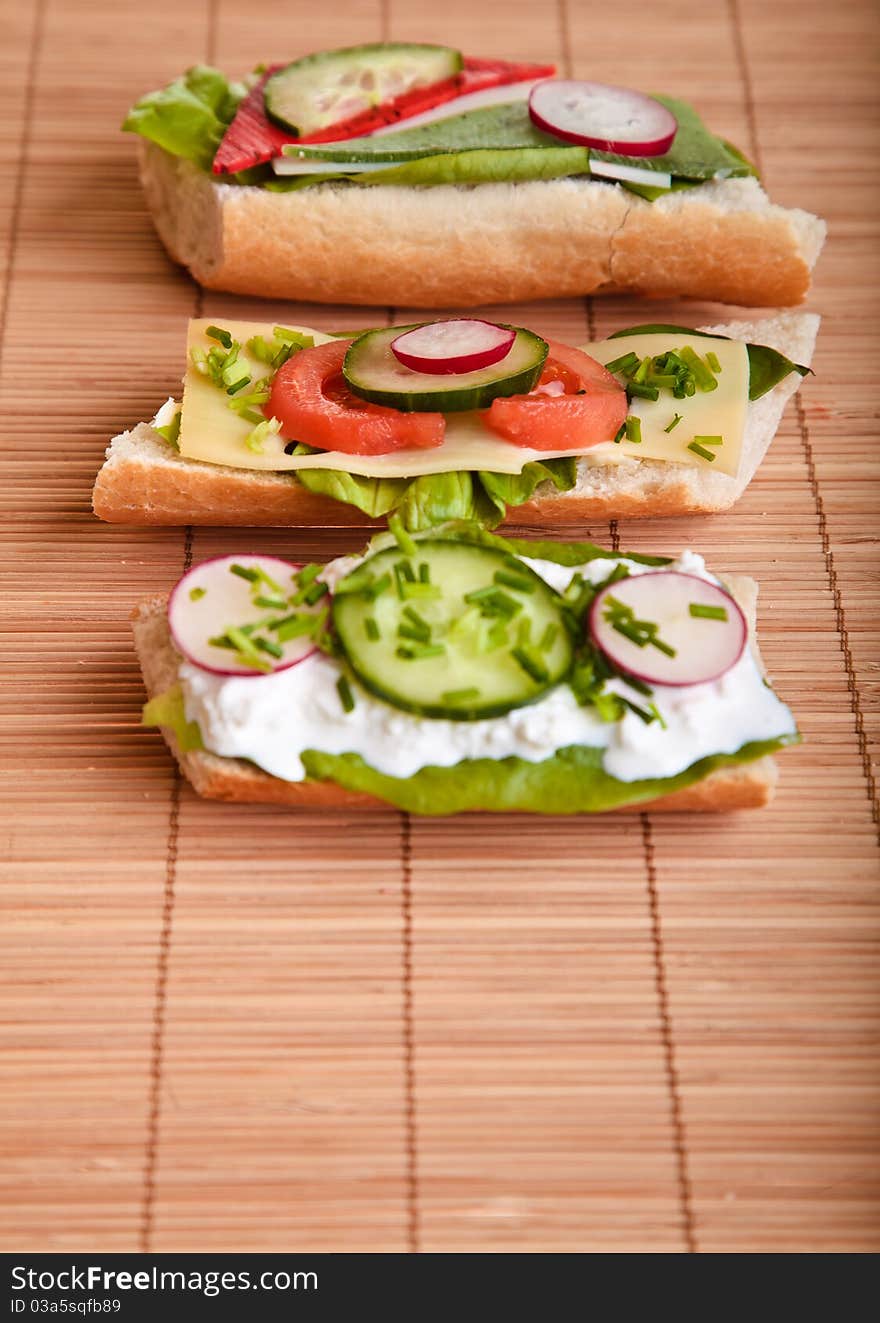 Different sandwiches with vegetables and cheese isolated