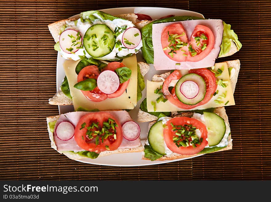 Different sandwiches with vegetables and cheese isolated