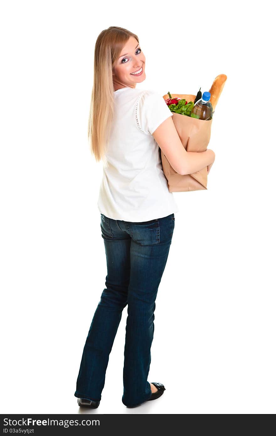 Woman carrying bag of groceries isolated on white