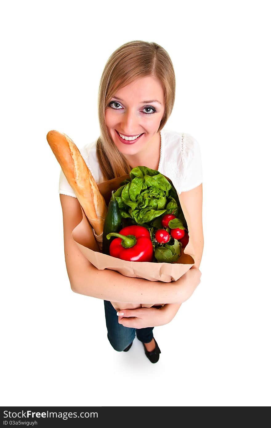 Woman carrying bag of groceries isolated on white