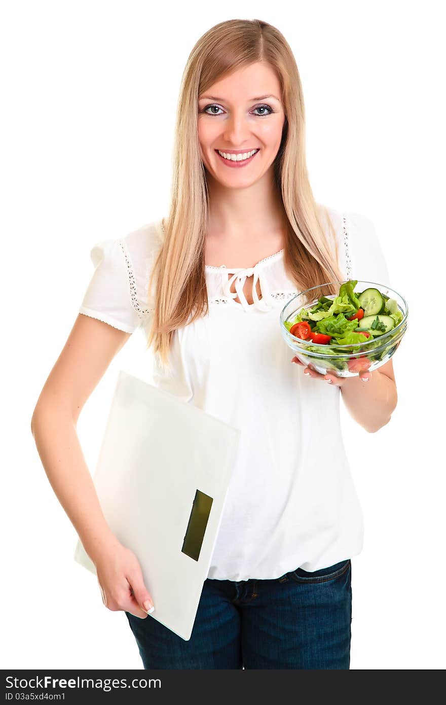 Woman with salad and scales isolated on white