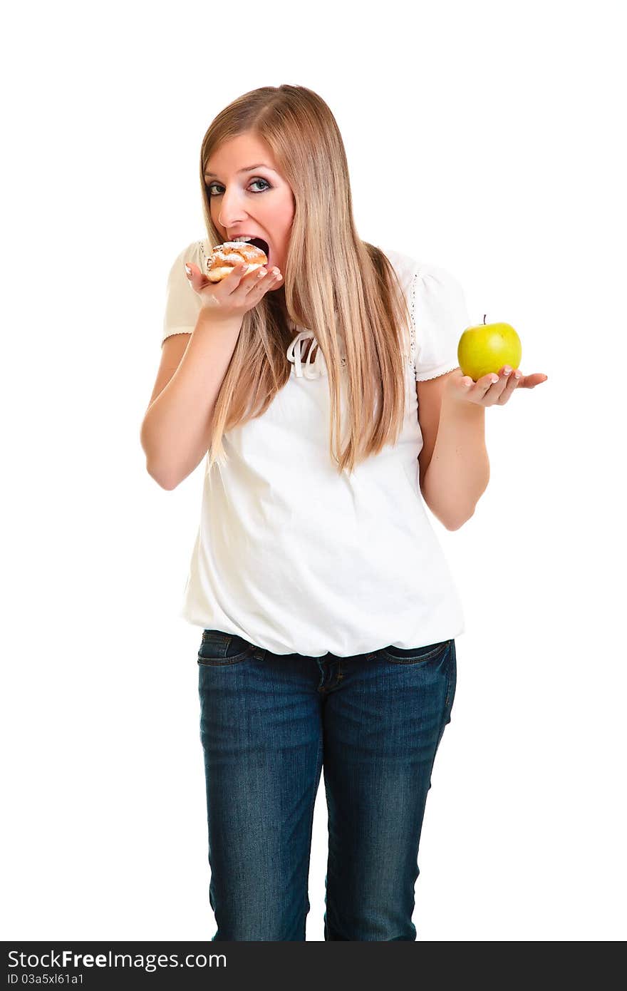 Woman choosing apple over puff cookie isolated on white