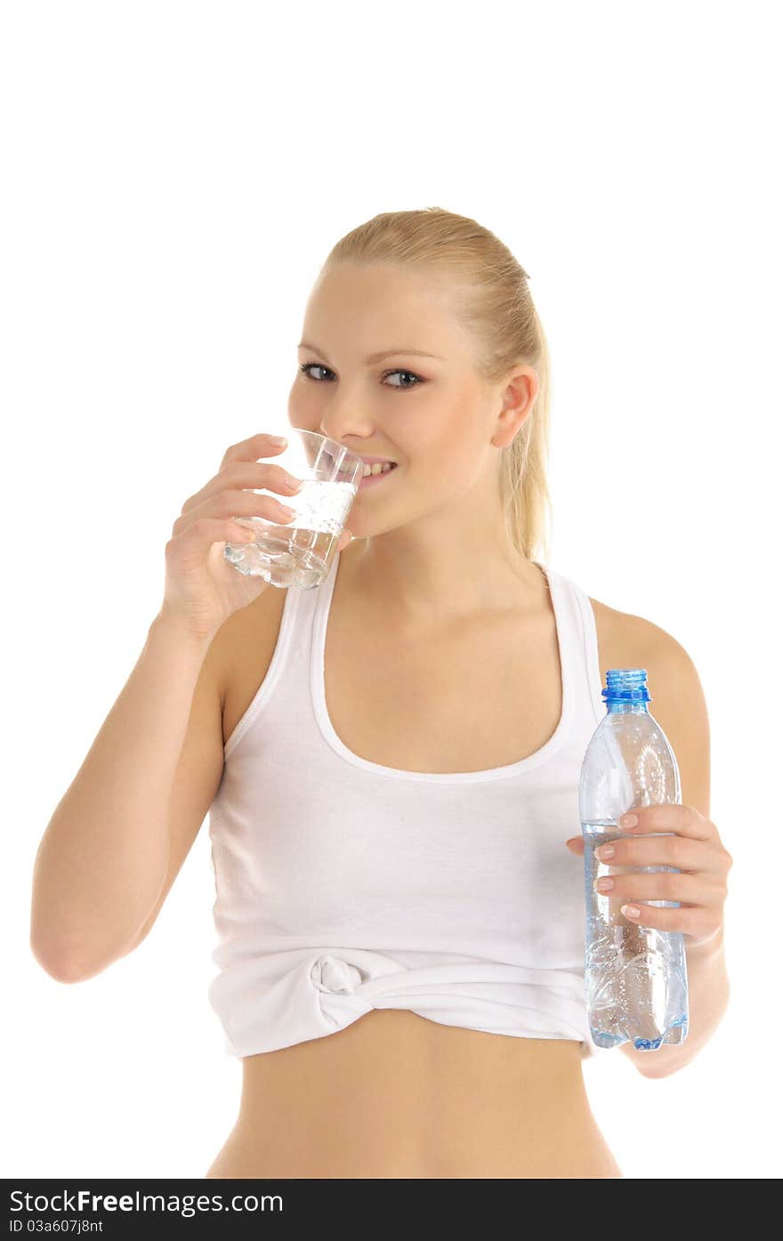 Happy woman drinks water from a glass