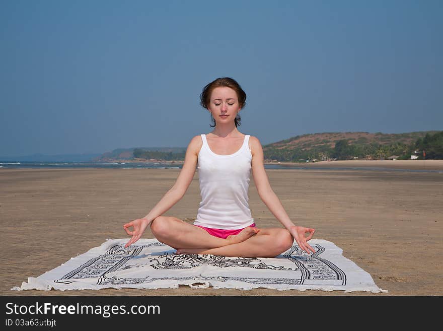 Young woman doing yoga in goa, india. Young woman doing yoga in goa, india