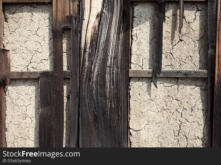 Mud wall and old plank