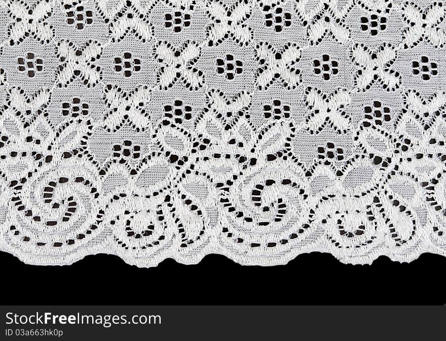 White lace with a floral pattern on a black background