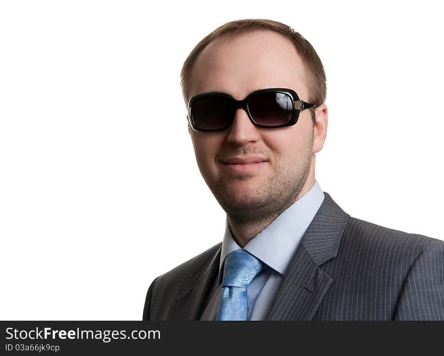 Portrait of an unshaven businessman in glasses with a white background