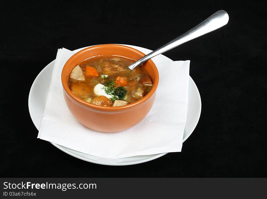 Mushroom soup at a black background