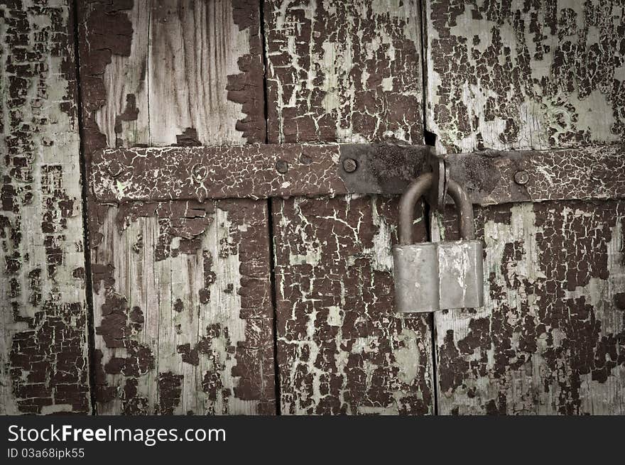 Old door and rusty lock