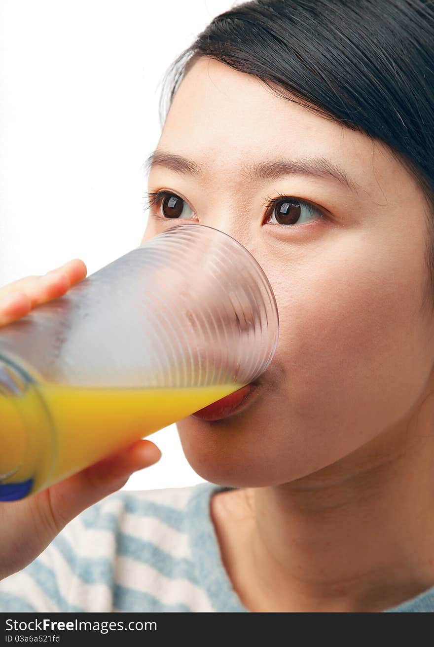 Woman drinking orange juice isolated on white