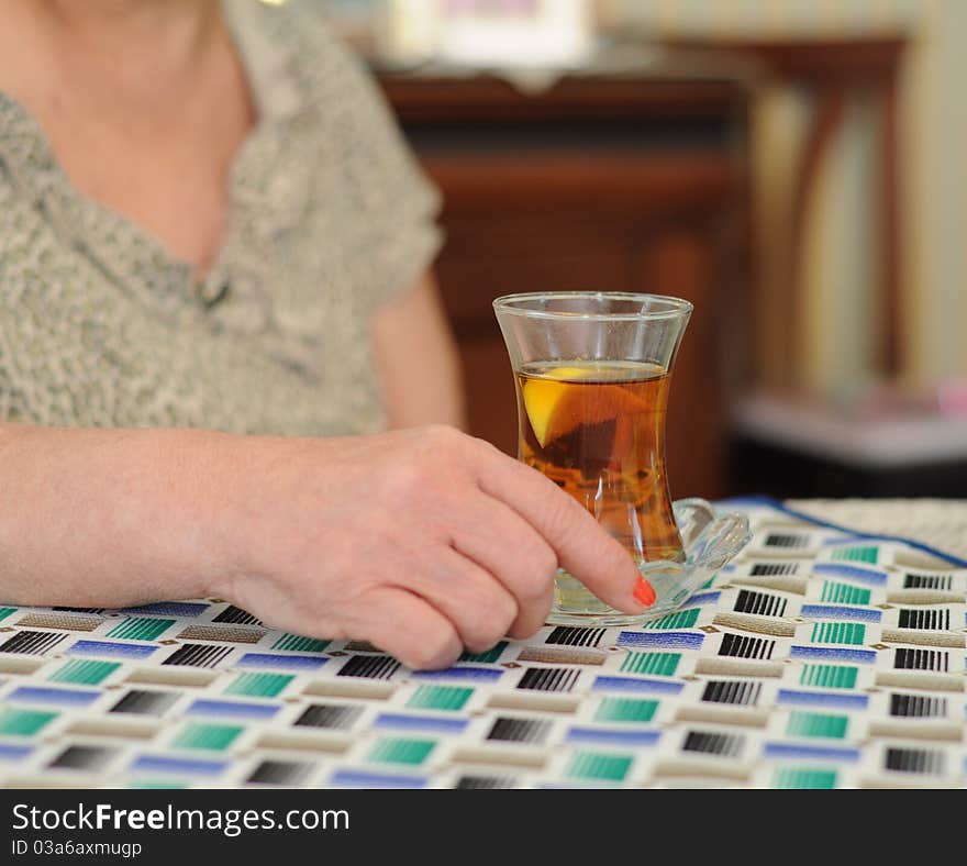 A senior woman drinking tea. A senior woman drinking tea