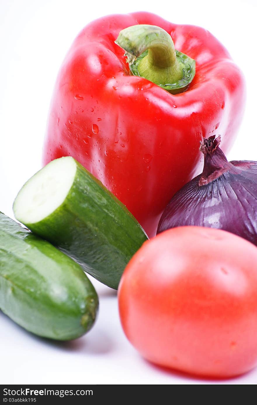 Fresh vegetables on the table with water drops.