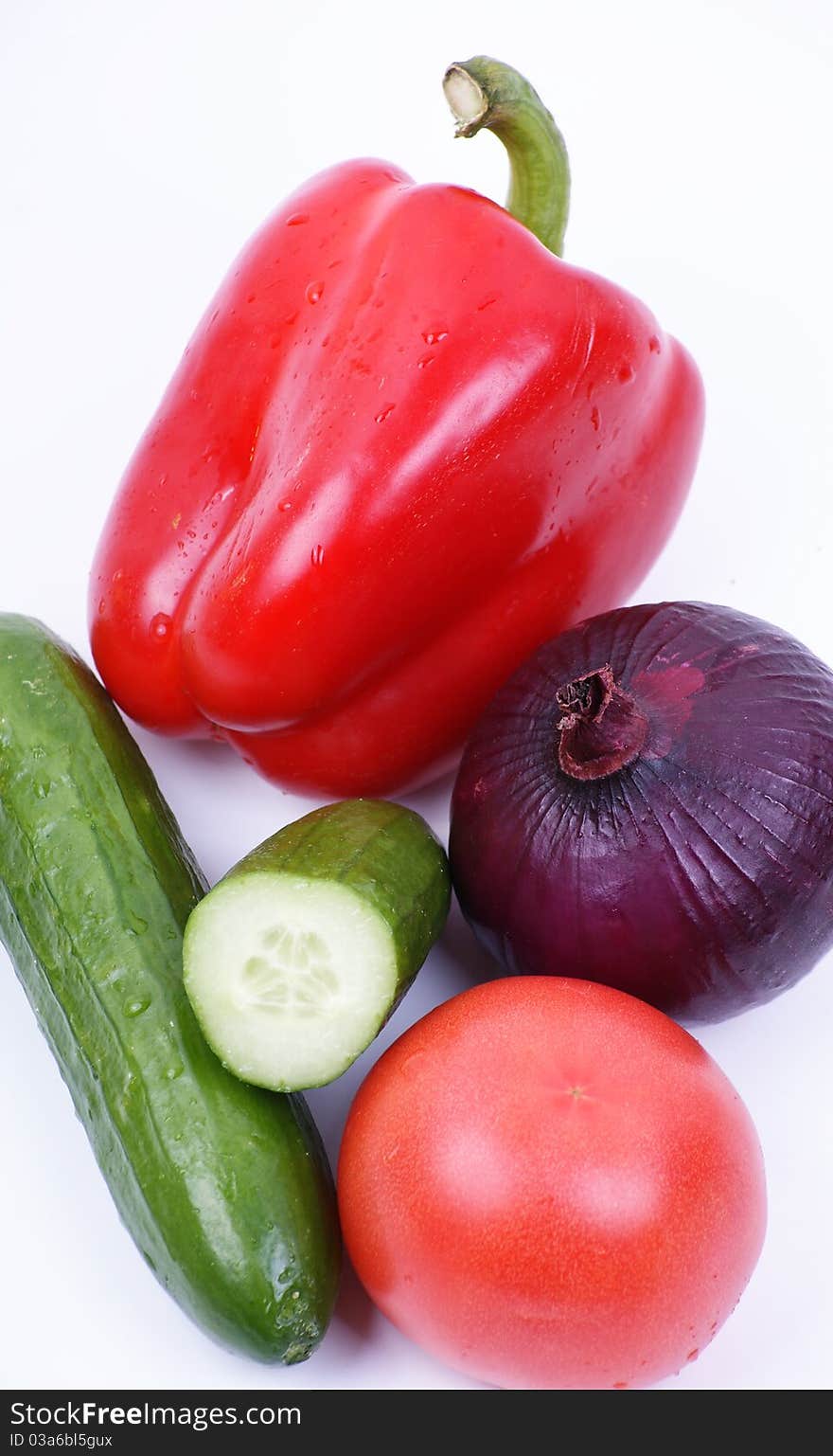 fresh colored vegetables on white background