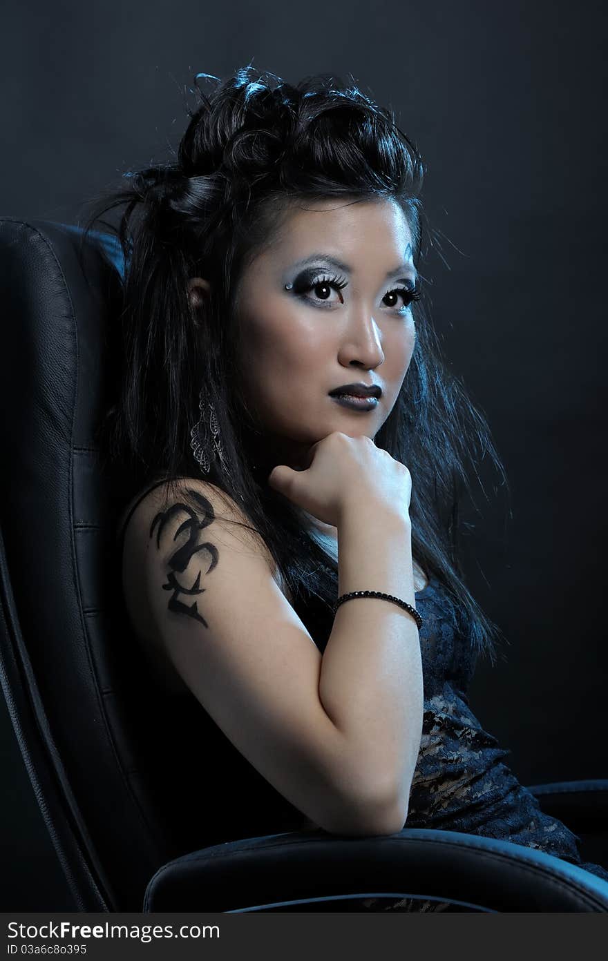 Gothic asian girl on black background