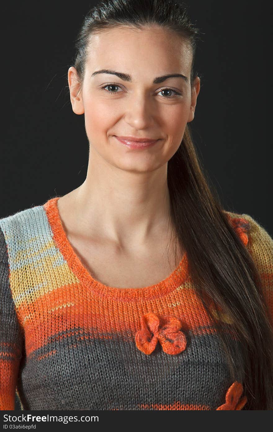 Portrait of young female in sweater, close-up