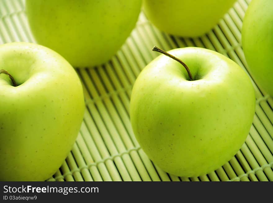 Freshness green apples on bamboo