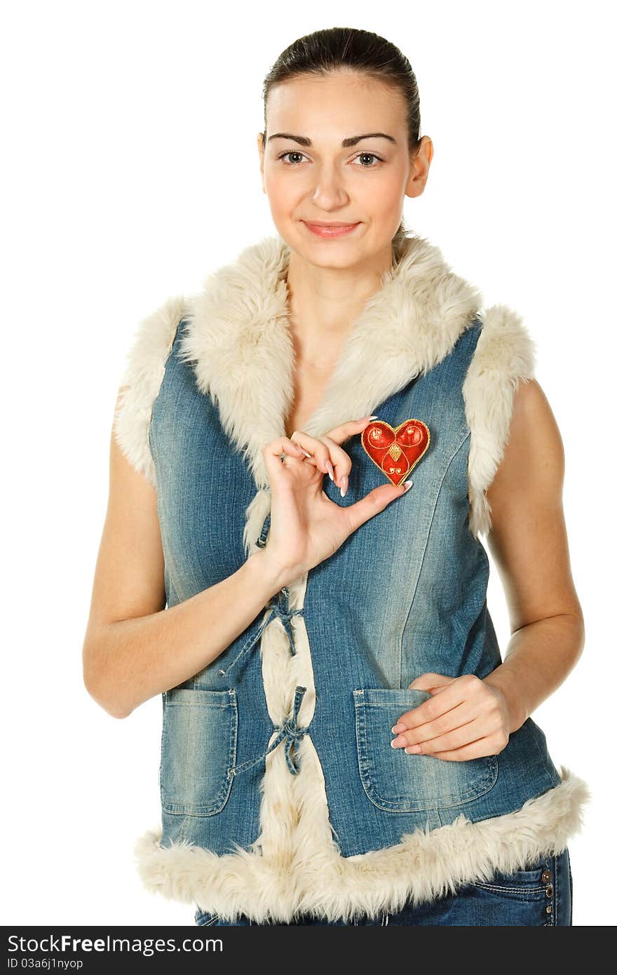 Portrait of young female in blue denim holding heart shape isolated on white. Portrait of young female in blue denim holding heart shape isolated on white