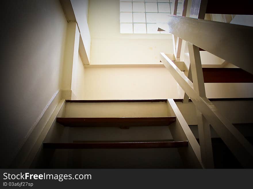 Stair brown walls with white light shining from the windows. Stair brown walls with white light shining from the windows