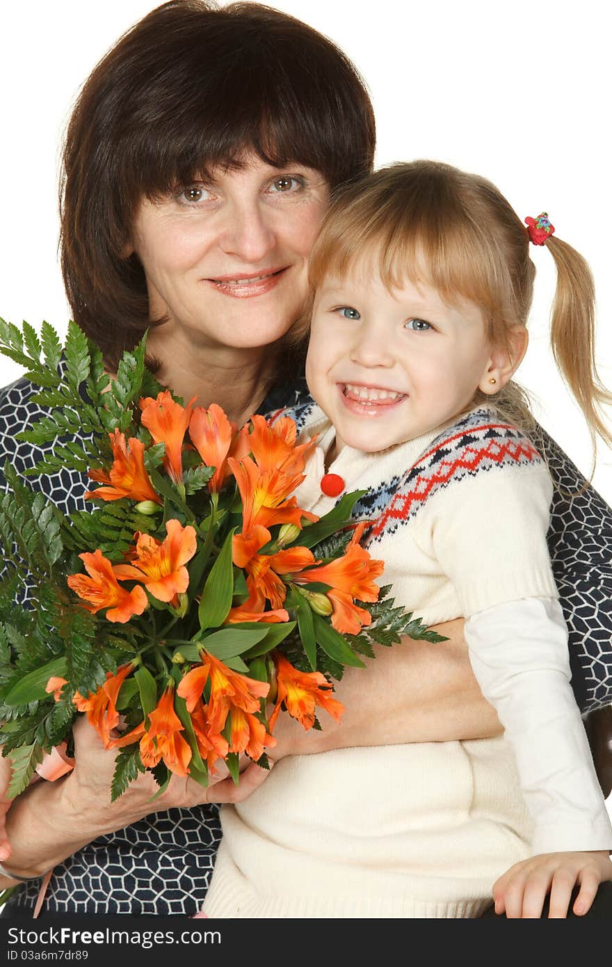 Grandmother And Granddaughter With Bunch Of Flower