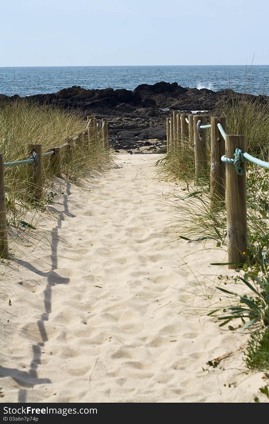 A sandy path leading to the sea. A sandy path leading to the sea