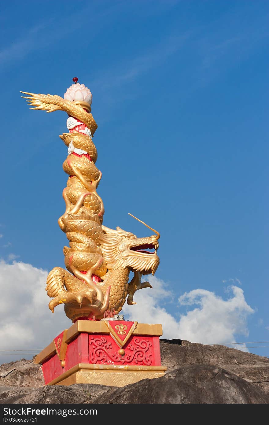 The gold dragon on blue sky