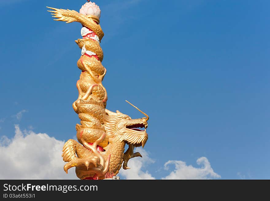 The gold dragon on blue sky