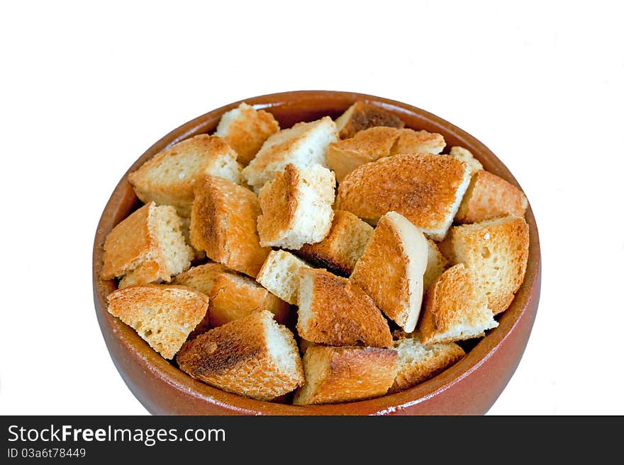 Bread rusk in a ceramic bowl isolated on white