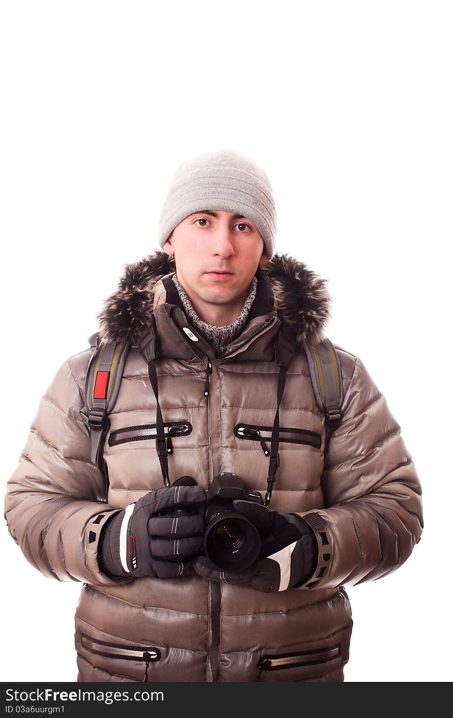 Traveller in winter clothes with camera(isolated on white). Traveller in winter clothes with camera(isolated on white)