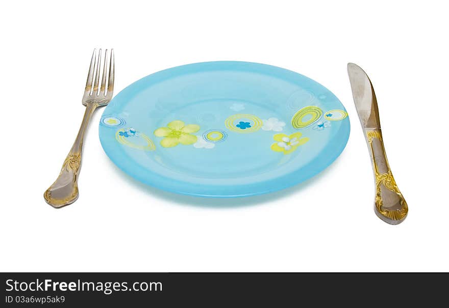 Blue Dish, knife, fork on a white background