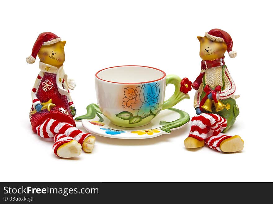 Cats and cup of tea on a white background