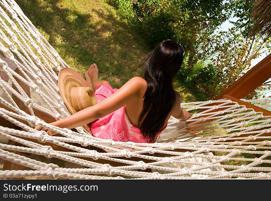 Young woman relaxing in hammock. Young woman relaxing in hammock