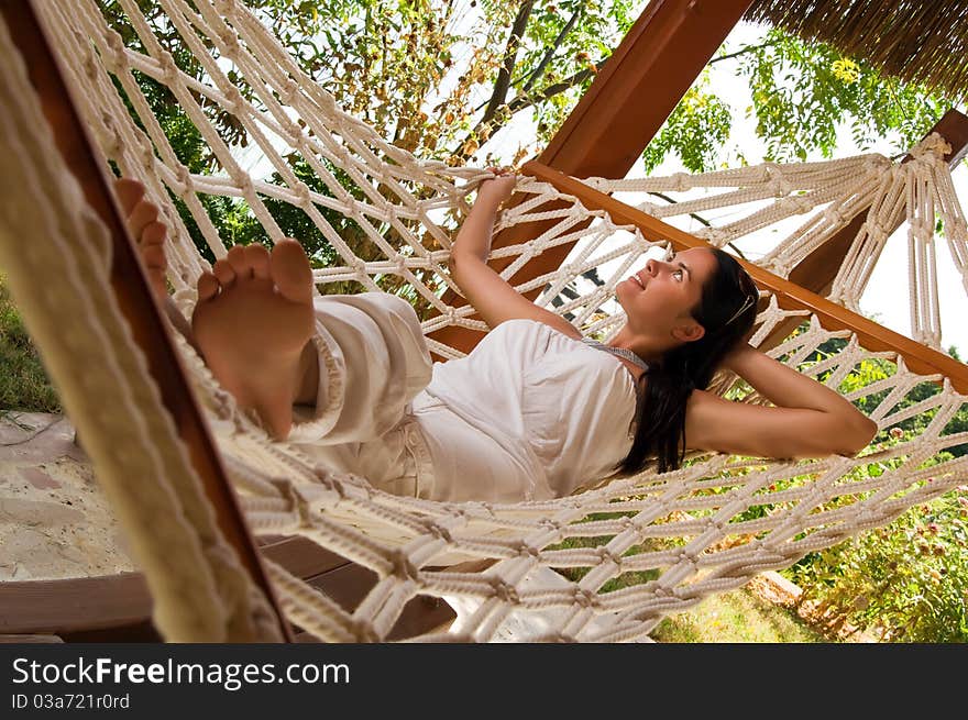 Young woman relaxing in hammock. Young woman relaxing in hammock