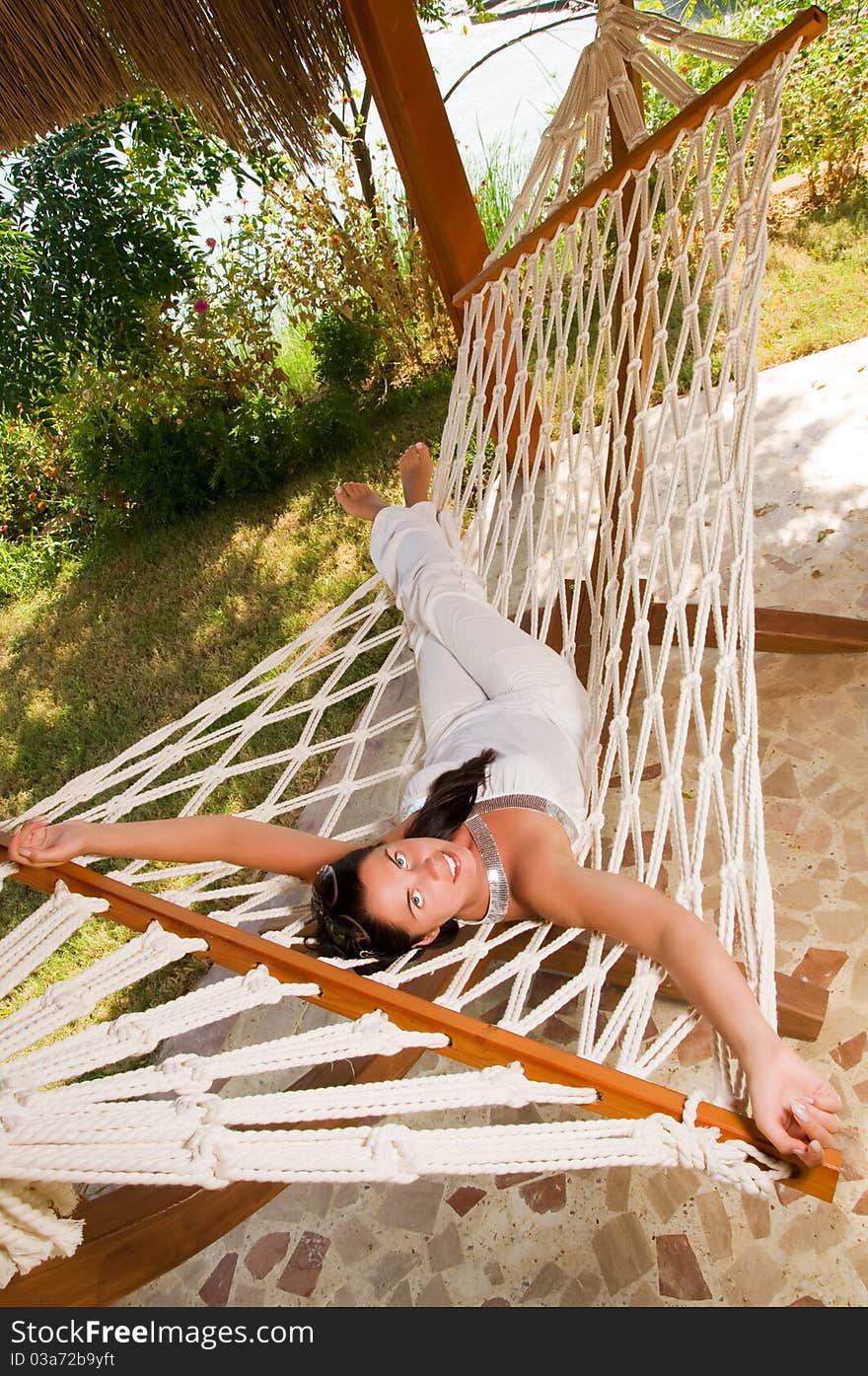 Young woman relaxing in hammock. Young woman relaxing in hammock