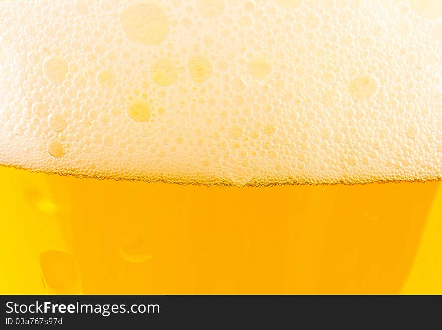 Light beer fresh in a glass of beer close up