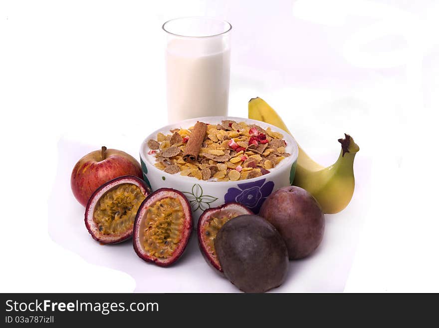 Detail view of a bowl of breakfast cereals surrounded by fruit. Detail view of a bowl of breakfast cereals surrounded by fruit.