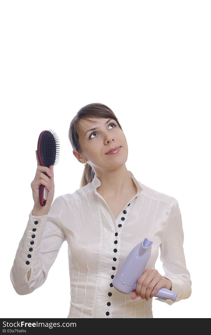 Isolated thinking woman with hairbrush and dryer