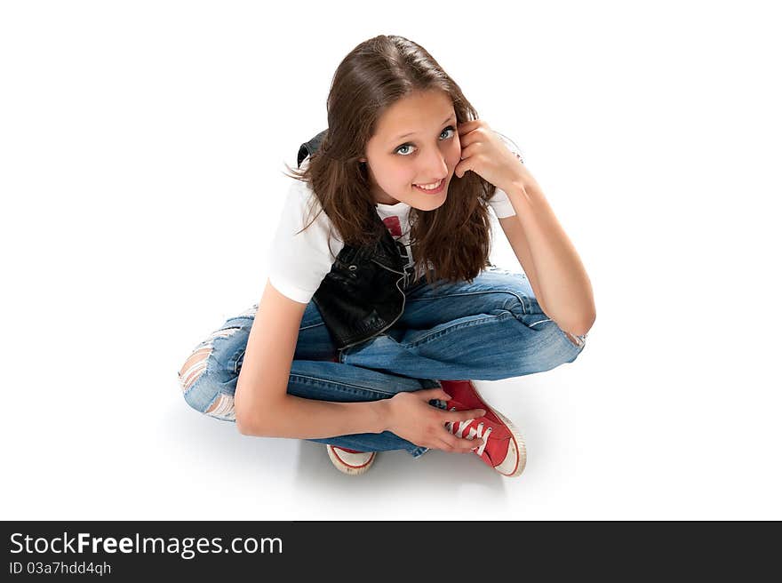 Teenage girl sitting on the floor