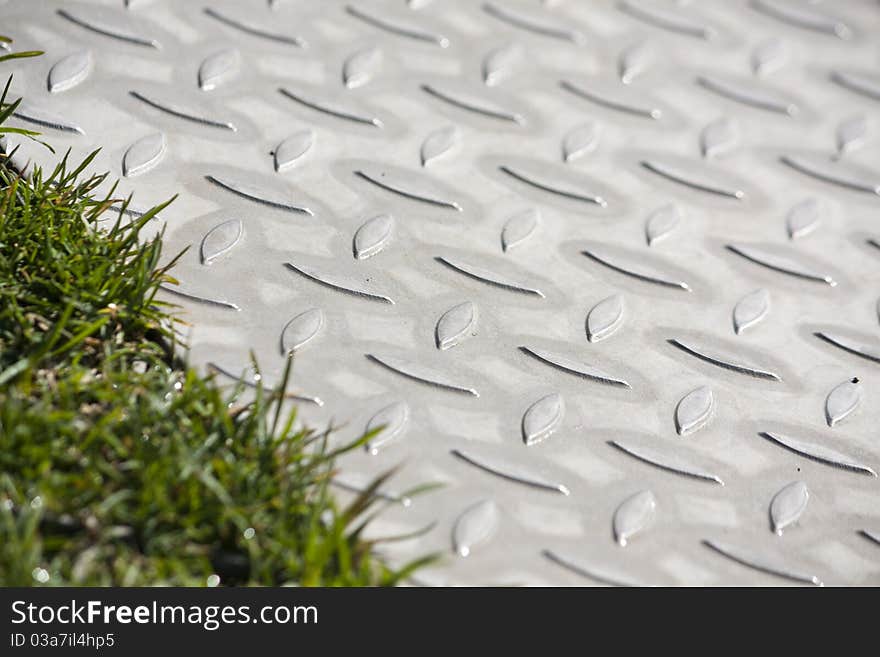 Close view of a steel walkway on a urban park. Close view of a steel walkway on a urban park.