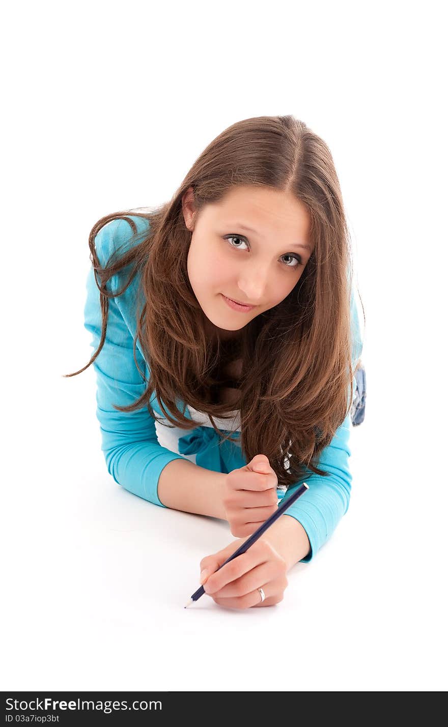 Young woman draws a pencil on a white floor. Isolated on white
