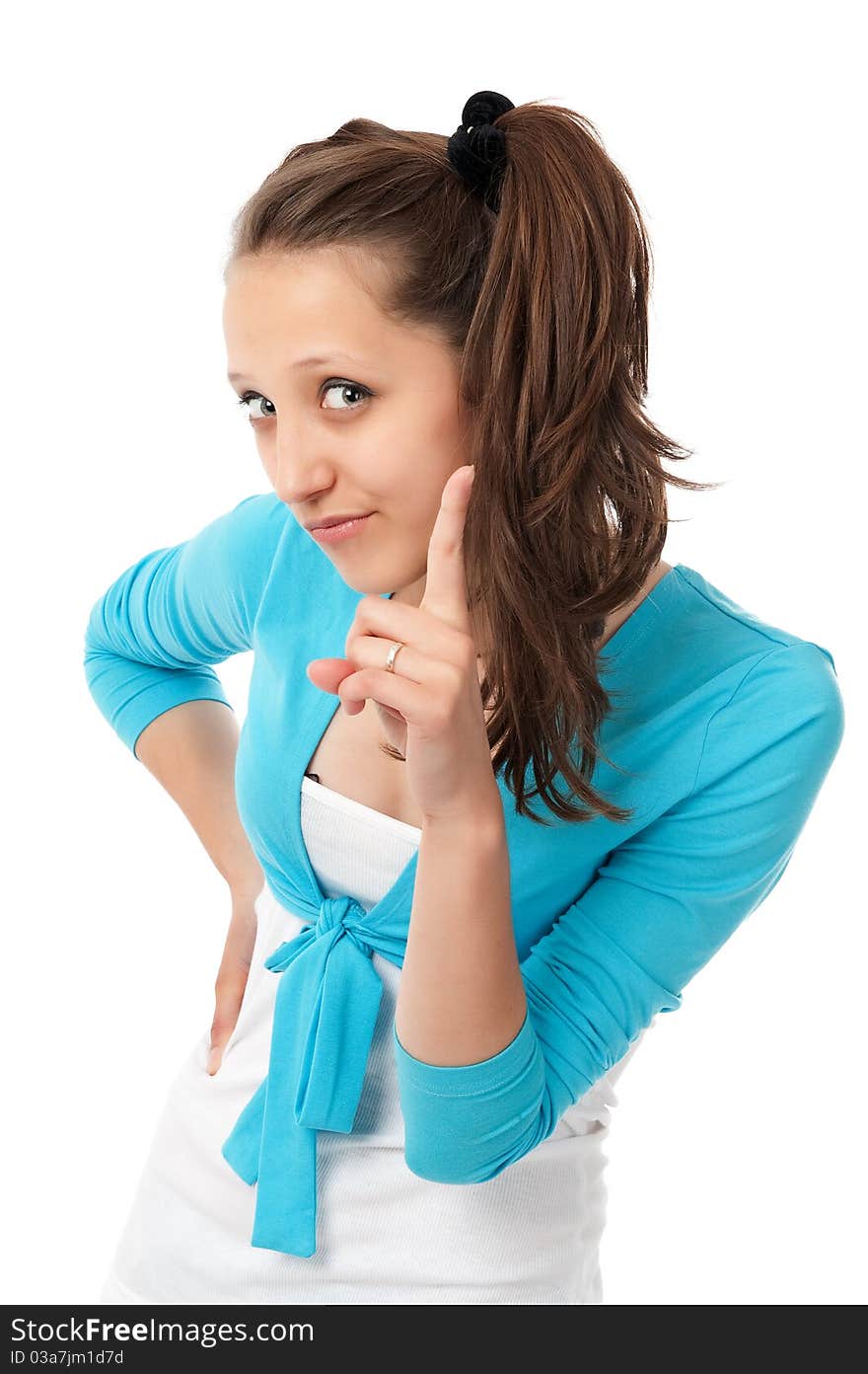 Attractive teenage girl with her finger up isolated on white