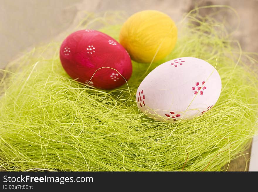 Colorful easter eggs on wooden background