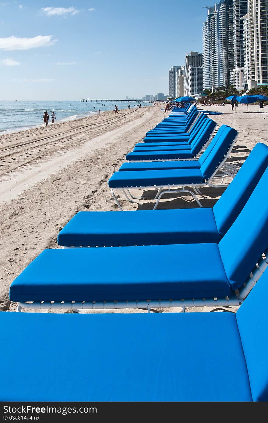 Blue lounge chairs on the beach