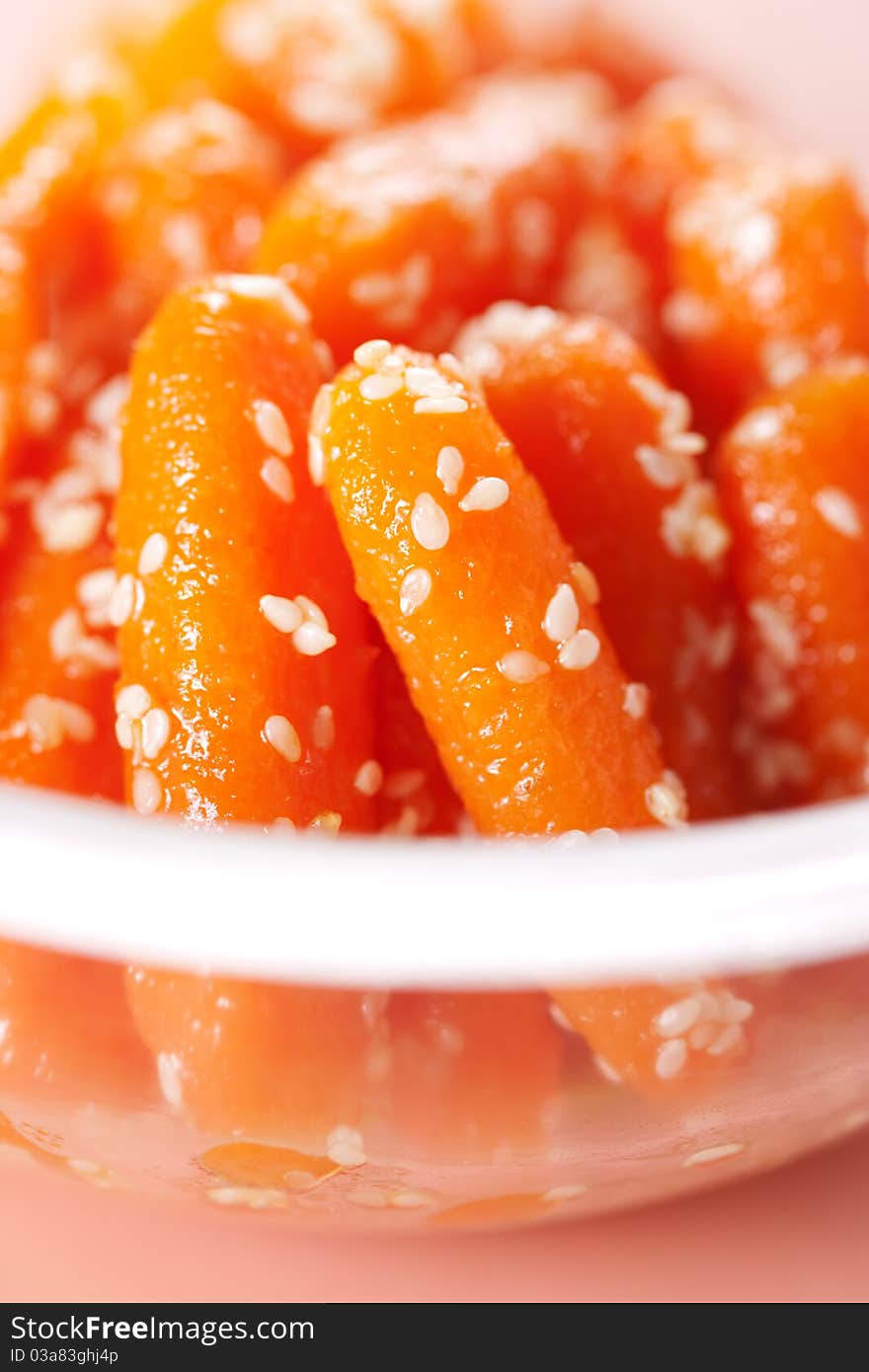 Honey glazed baby carrots with sesame seeds