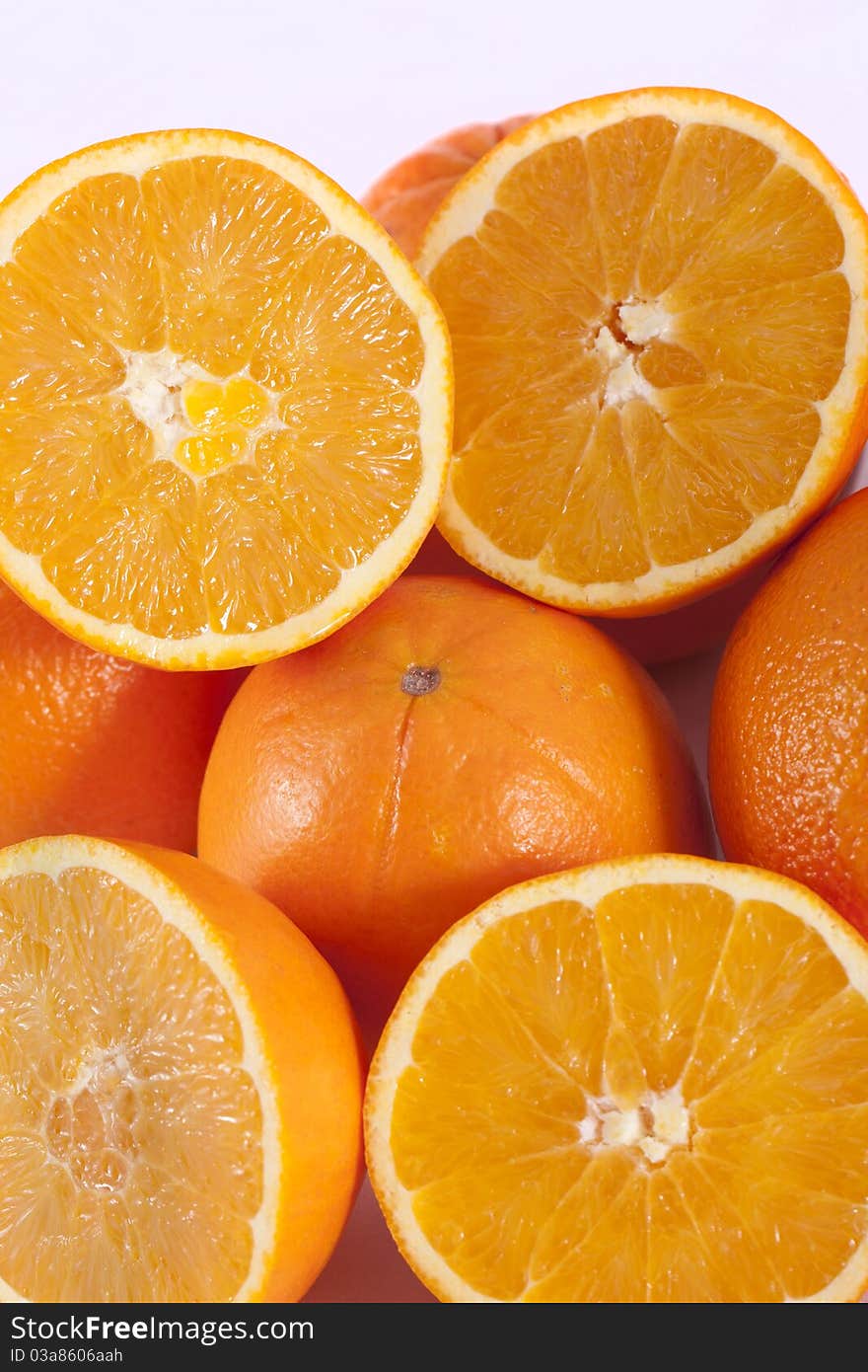 Detail view of a bunch of oranges isolated on a white background.