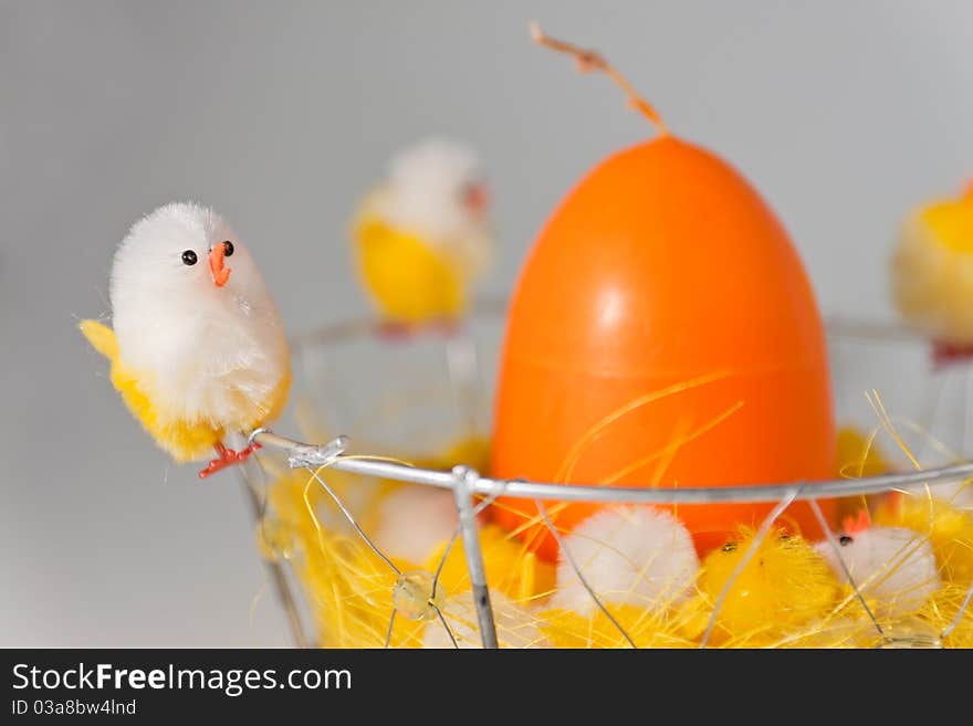 White and Yellow Easter chick with orange egg