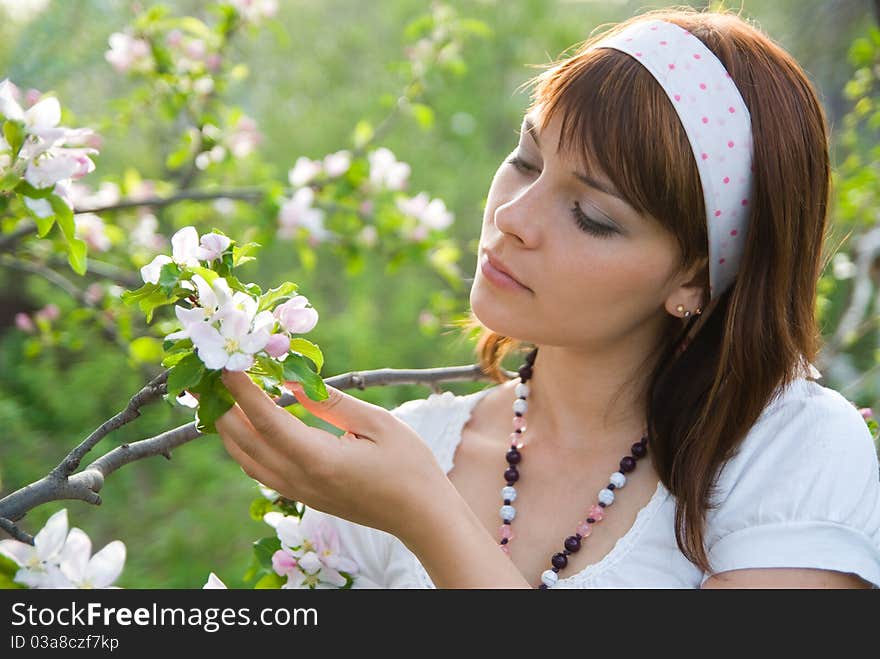 Girl and spring apple blossom