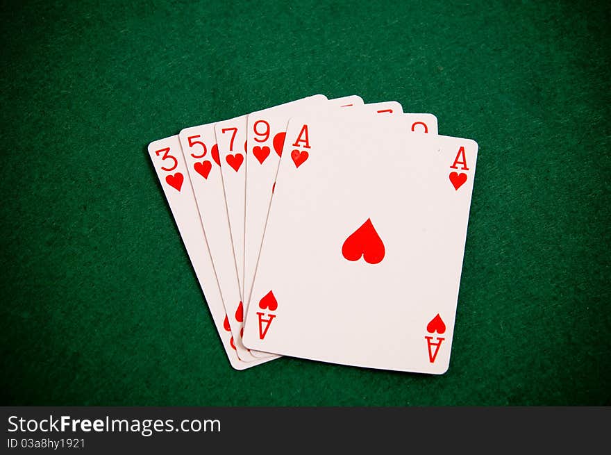 Playing cards on green background, Poker figure - colour