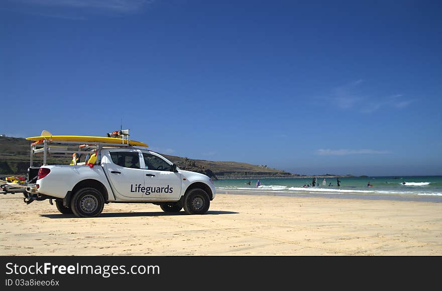 Lifeguards rescue vehicle situated on a beach in cornwall during the summer. Lifeguards rescue vehicle situated on a beach in cornwall during the summer